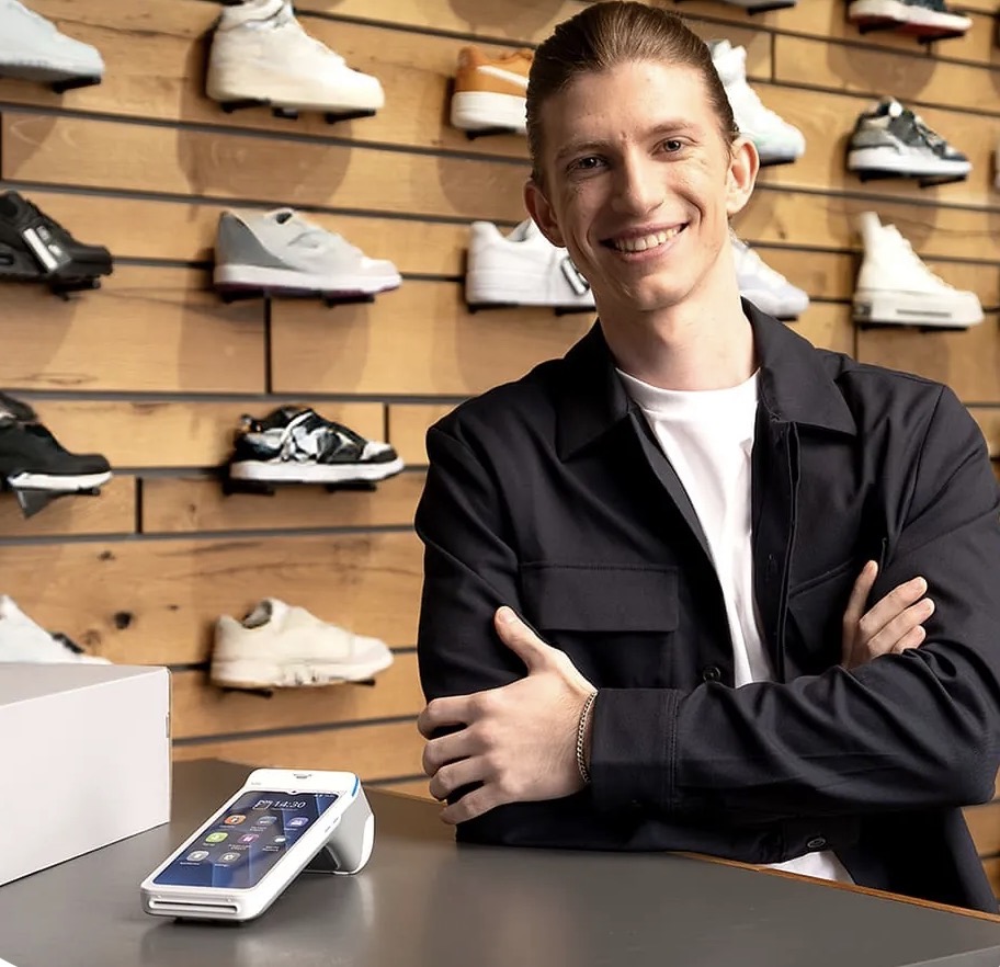 Business owner taking a contactless card payment with the myPOS Ultra terminal